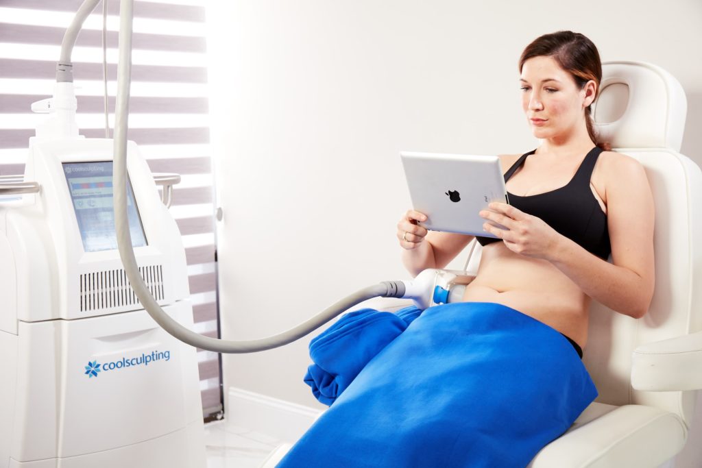 a patient having coolsculpting performed on their stomach