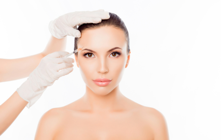 Women receiving Botox brow lift from professional