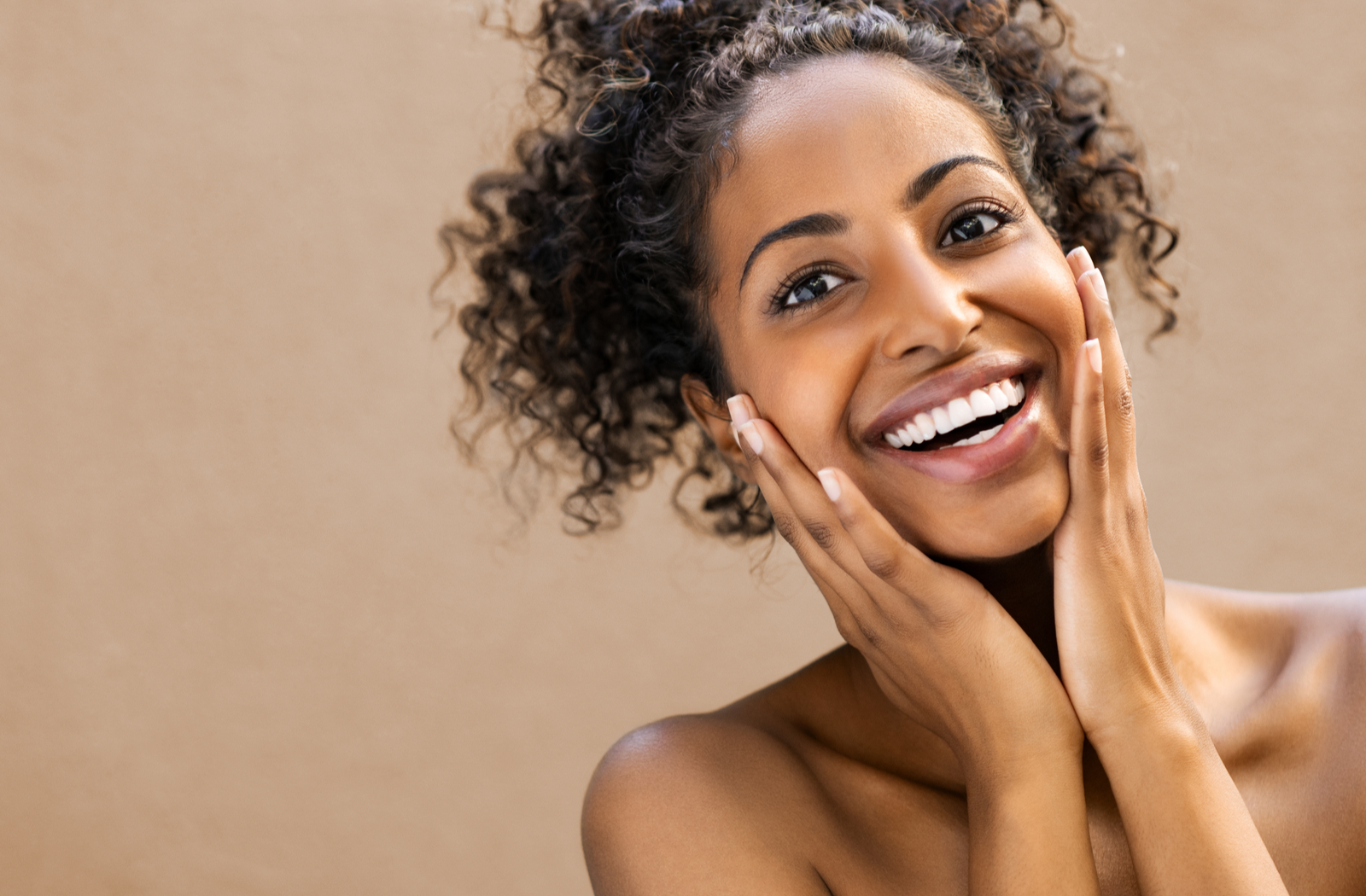 Smiling women touching clear and beautiful looking skin