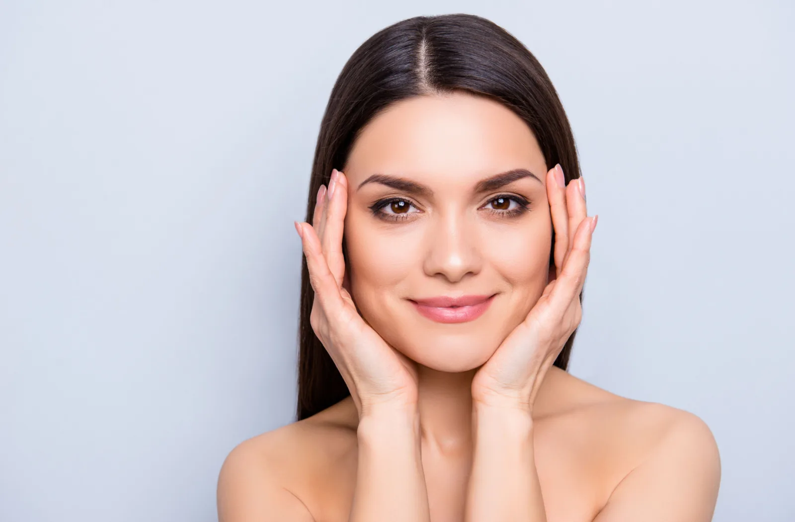 Young adult woman with rejuvenated skin post Botox session.